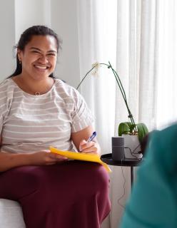 An image of an Encouraging Therapist Talking With a Female Patient