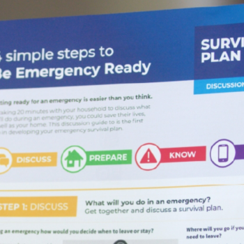 A pamphlet with a title visible that reads "4 Simple Steps to Be Emergency Ready" and "Survival Plan" the rest of the text is not readable.