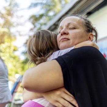 Mother Hugging Daughter