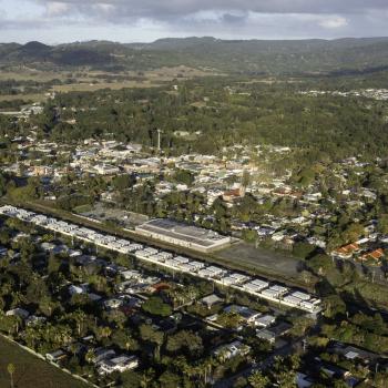 An aerial view of a town with temporary accommodation lined together.