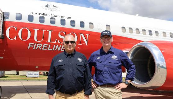 NEMA's Deputy Coordinator-General and Coordinator-Genera posing in front of the National Large Air Tanker