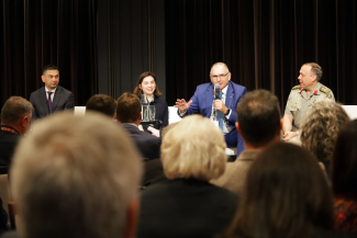 Deputy Coordinator-General Joe Buffone and Deputy Coordinator-General Dr Jill Charker sit on a stage answering questions from the crowd.